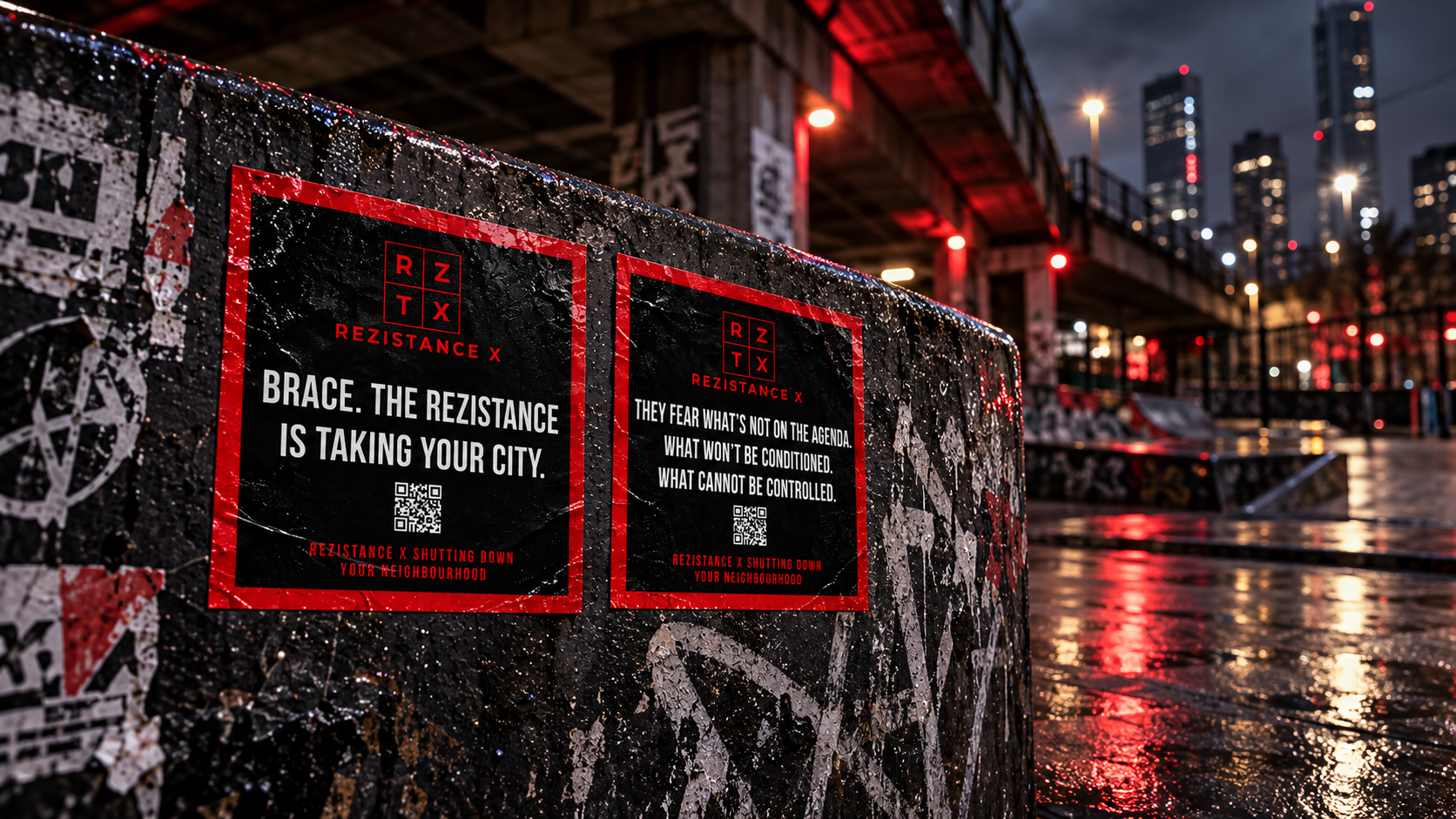 Rezistance stickers on an urban wall at night