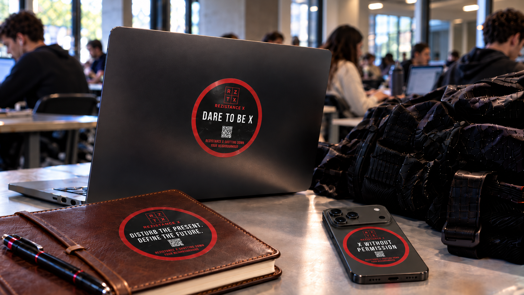 Round Rezistance stickers on a laptop, notebook and phone
